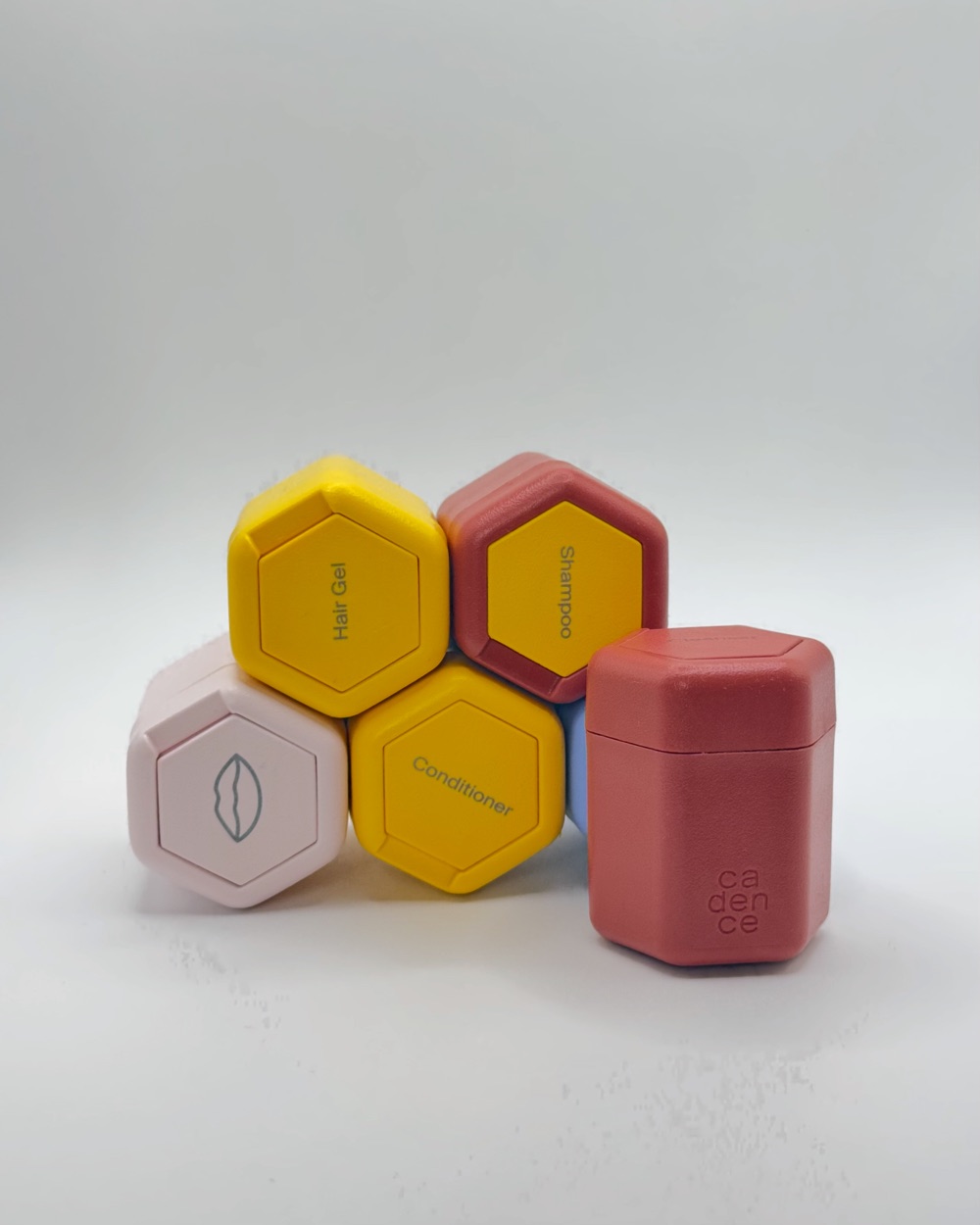 Stack of hexagonal Cadence travel capsules