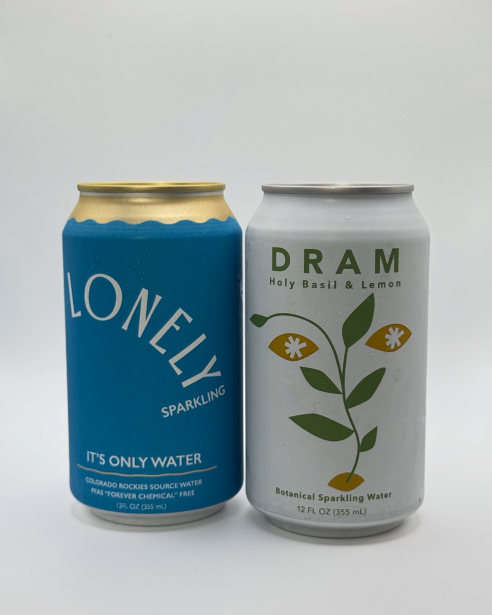Cans of Lonely and Dram sparkling water