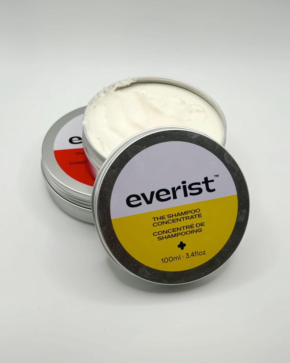 Everist shampoo and conditioner concentrate tins