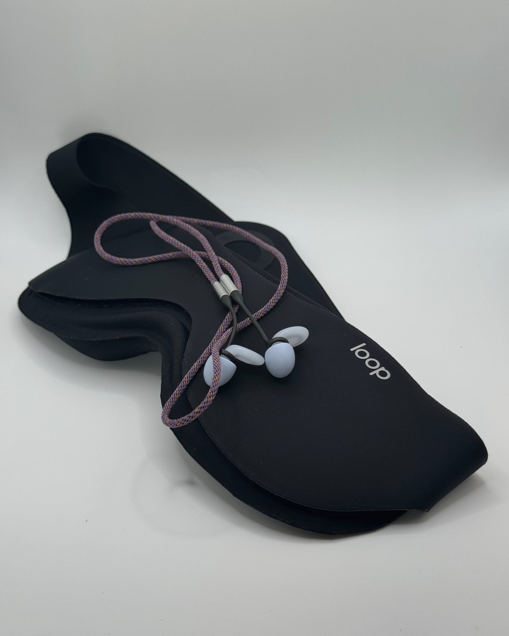 Loop sleep mask with earplugs on a leash
